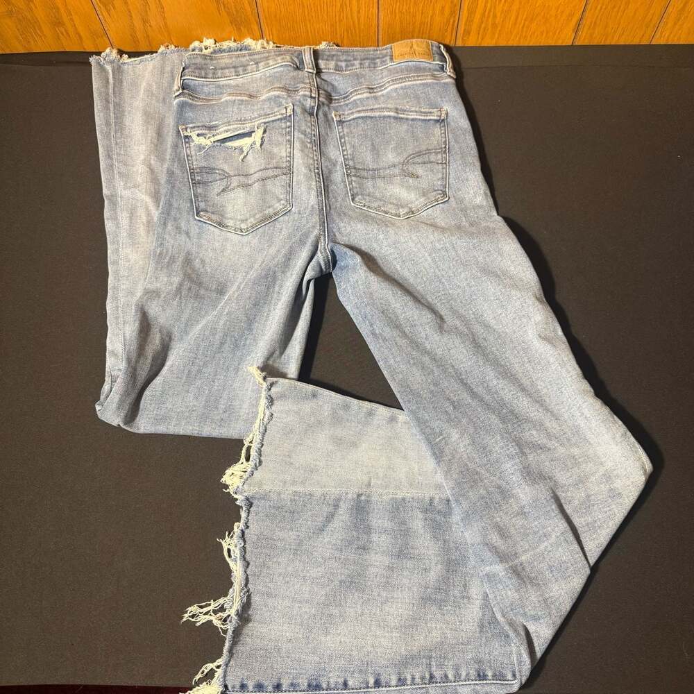 American Eagle Next Level Stretch High-Rise Distressed Wide-Leg Raw Hem Jeans